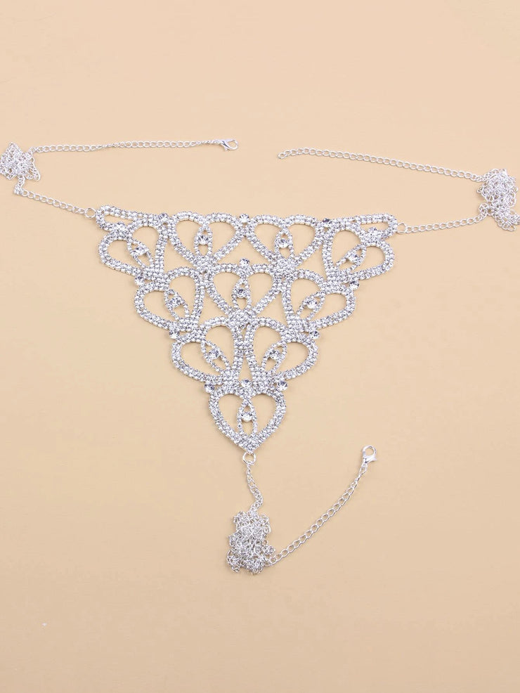 Silver bikini thongs featuring a heart pattern adorned with cubic zirconia rhinestones